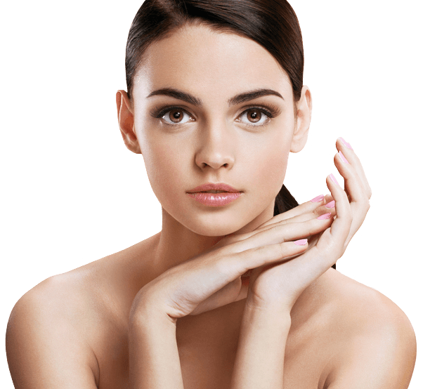 Young woman with smooth skin, enhanced by Algologie Skin care, and dark hair pulled back, looking directly at the camera with her hands gently touching near her chin; background is plain and light-colored. Home Direct From The Therapist results.